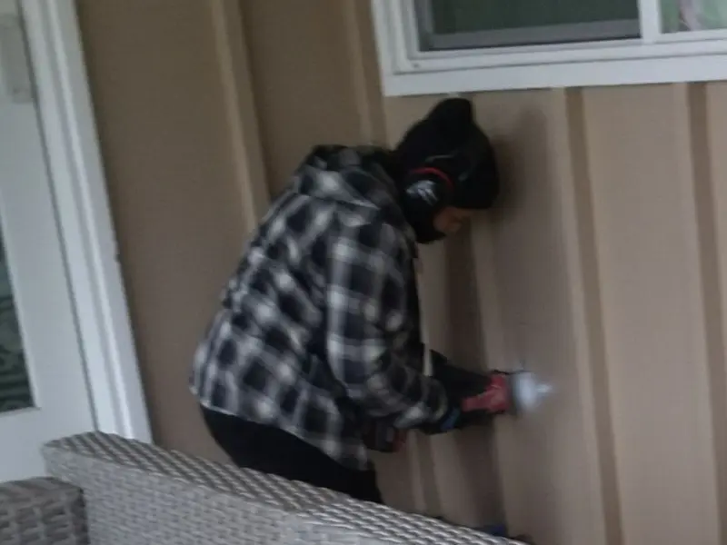 Professional electrician installing an exterior outlet in Fairfield